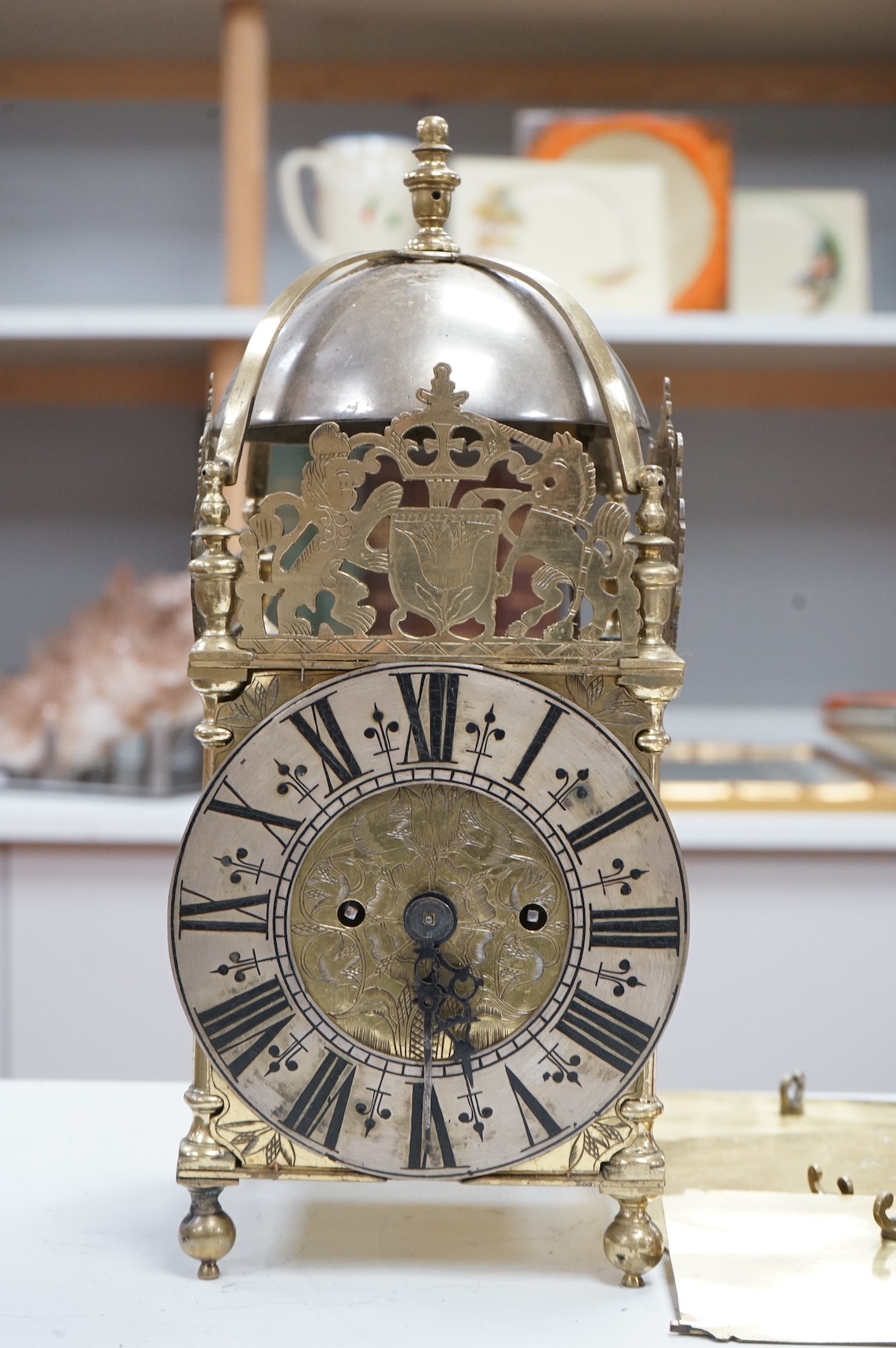 A twin fusee brass lantern clock, 38cm high.